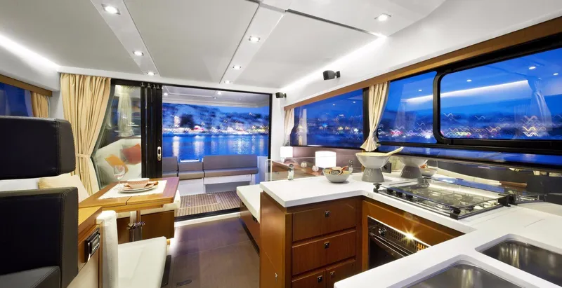  Yacht Photos Pics Manufacturer Provided Image: Interior of 2017 Jeanneau Velasco 43 yacht with modern kitchen and scenic view.