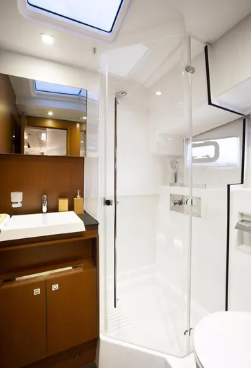  Yacht Photos Pics Manufacturer Provided Image: Modern bathroom in 2017 Jeanneau Velasco 43 yacht with shower and sink.