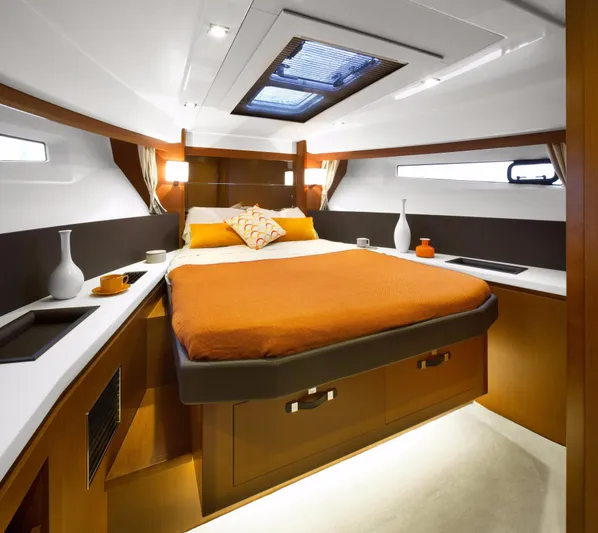  Yacht Photos Pics Manufacturer Provided Image: Luxurious cabin interior of 2017 Jeanneau Velasco 43 yacht with orange bedding.