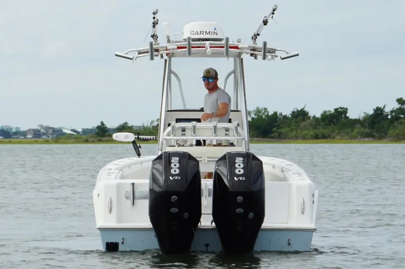  Yacht Photos Pics 2024 Contender 25 Tournament boat with dual 200 V6 engines on water.