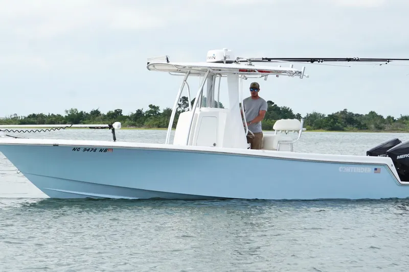  Yacht Photos Pics 2024 Contender 25 Tournament boat on water, featuring sleek design and modern equipment.