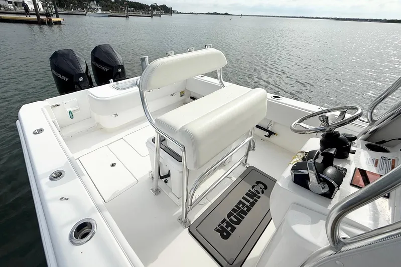  Yacht Photos Pics 2024 Contender 25 Tournament boat interior with dual Mercury engines, white seating, and steering console.