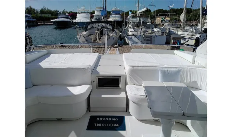  Yacht Photos Pics Luxury yacht Pershing 54, 2002 model, with spacious deck and marina view.