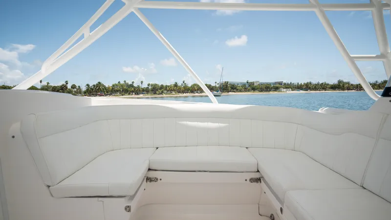 Yacht Photos Pics Intrepid 400 Cuddy 2013 boat interior with white seating, ocean view, and clear sky.