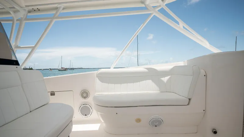  Yacht Photos Pics Intrepid 400 Cuddy 2013 boat interior with white seating and ocean view.
