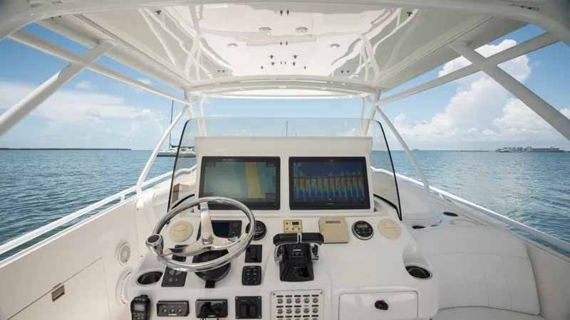  Yacht Photos Pics Intrepid 400 Cuddy 2013 boat helm with dual screens on open water.