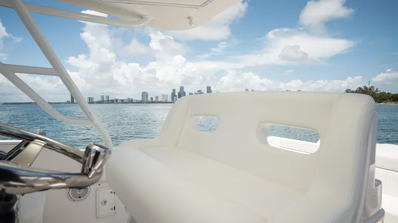  Yacht Photos Pics Intrepid 400 Cuddy 2013 boat interior with ocean and city skyline view.