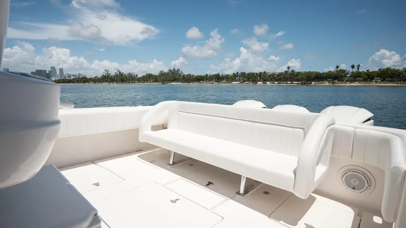  Yacht Photos Pics Intrepid 400 Cuddy 2013 boat interior with white seating, overlooking calm waters.