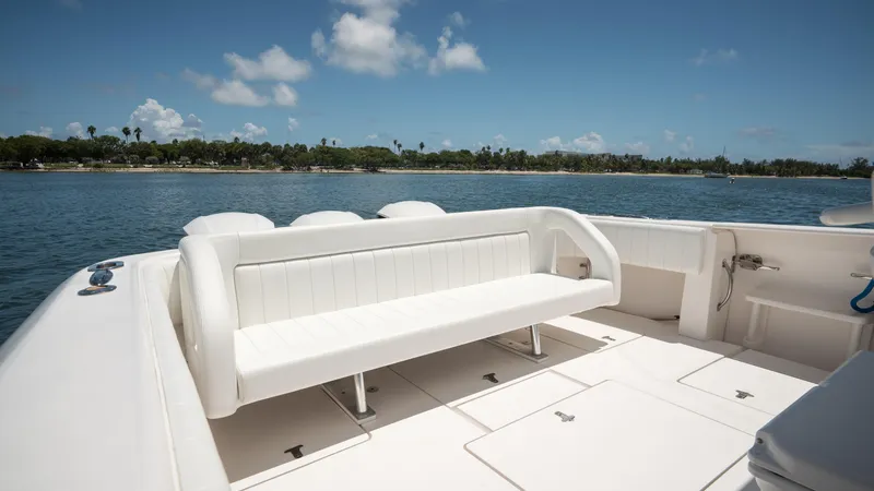  Yacht Photos Pics 2013 Intrepid 400 Cuddy boat with white seating, ocean view, and clear sky.