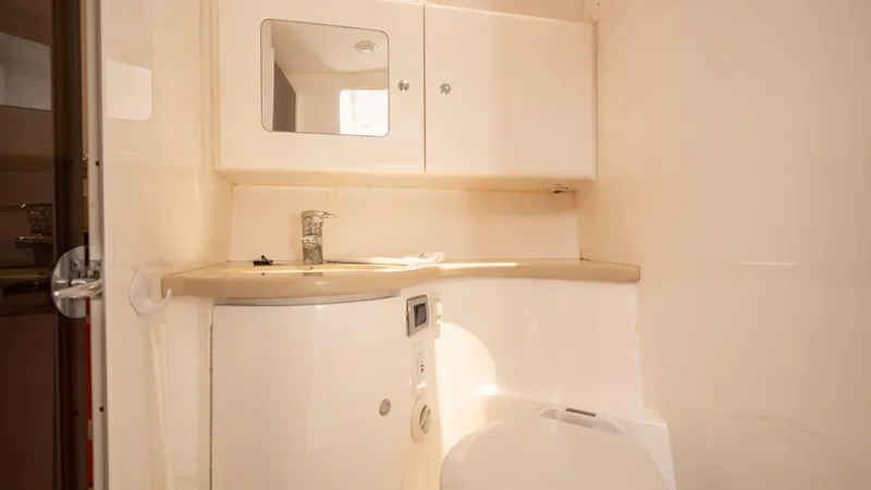  Yacht Photos Pics 2013 Intrepid 400 Cuddy bathroom with modern fixtures and storage cabinets.