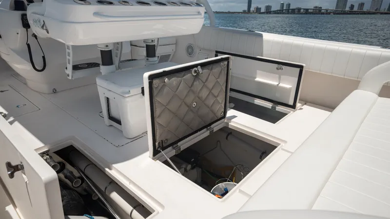  Yacht Photos Pics 2013 Intrepid 400 Cuddy boat interior with open storage compartments.