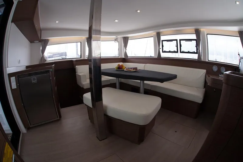 Stolos Yacht Photos Pics Interior of 2020 Lagoon 42 yacht with modern seating and dining area.