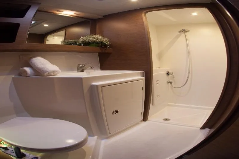 Stolos Yacht Photos Pics Modern bathroom interior of 2020 Lagoon 42 yacht with shower and sink.