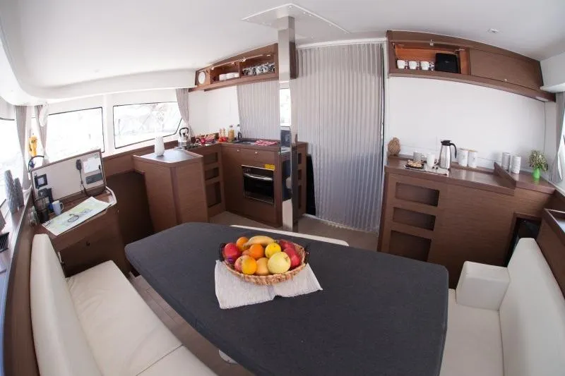Stolos Yacht Photos Pics Interior of 2020 Lagoon 42 catamaran with modern kitchen and dining area.