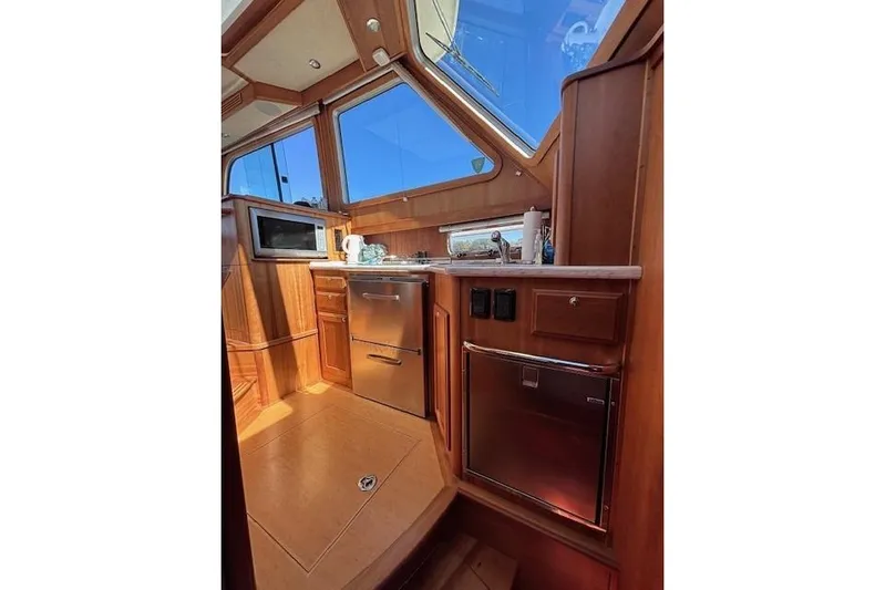 Independence Yacht Photos Pics Interior of 2012 Sabre 42 Salon Express yacht with wooden cabinetry and modern appliances.