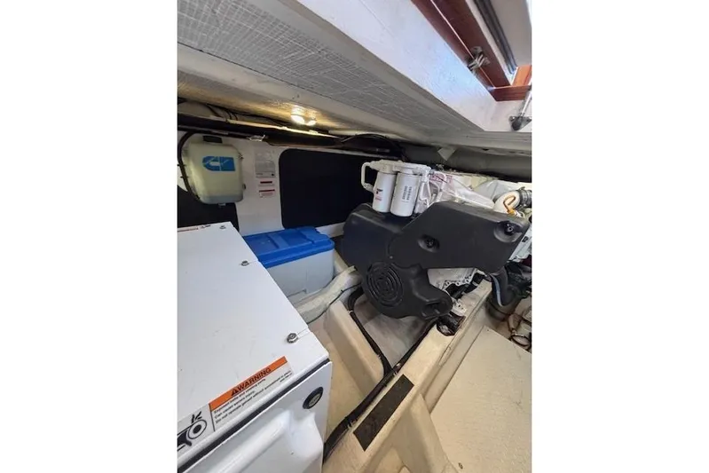 Independence Yacht Photos Pics Engine room of 2012 Sabre 42 Salon Express, showcasing mechanical components and storage.