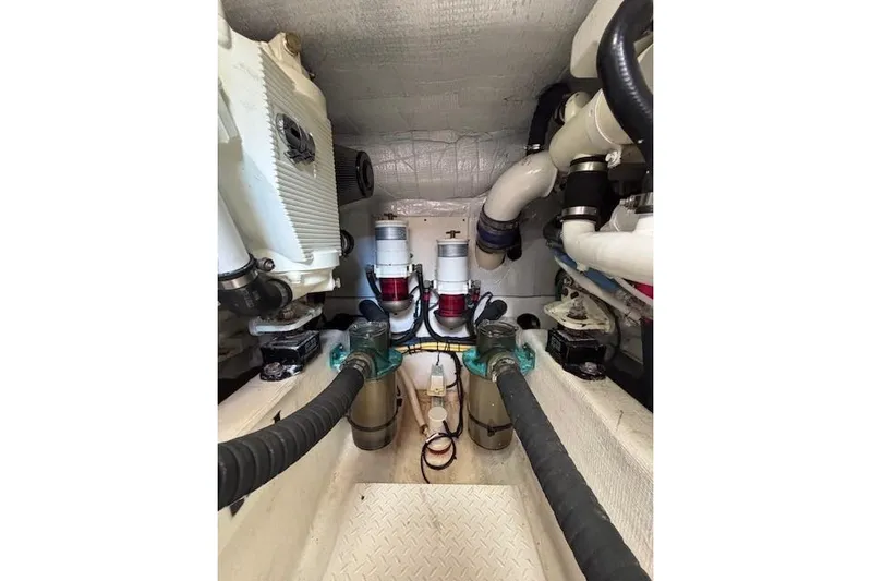 Independence Yacht Photos Pics Engine room of 2012 Sabre 42 Salon Express with visible pipes and machinery.