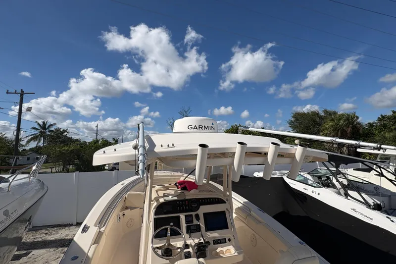  Yacht Photos Pics 2018 Grady-White Canyon 306 boat with Garmin equipment under a clear blue sky.