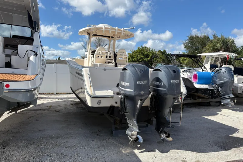  Yacht Photos Pics 2018 Grady-White Canyon 306 boat with twin Yamaha engines, parked outdoors.