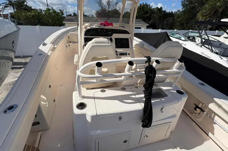  Yacht Photos Pics 2018 Grady-White Canyon 306 boat interior with helm and seating area.