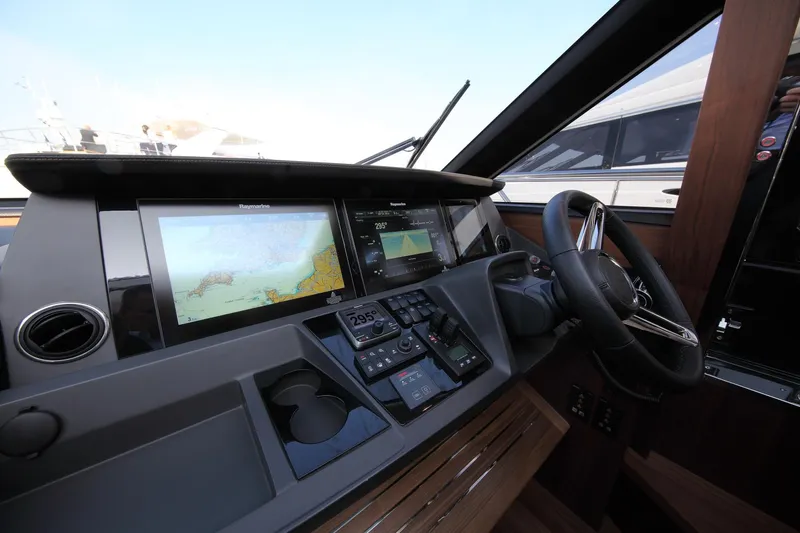  Yacht Photos Pics Helm of 2018 Princess S65 yacht with navigation screens and controls.