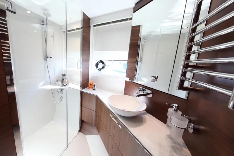  Yacht Photos Pics Luxurious bathroom in 2018 Princess S65 yacht with modern fixtures and elegant design.