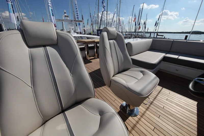  Yacht Photos Pics Luxurious seating on 2018 Princess S65 yacht with elegant deck and marina view.