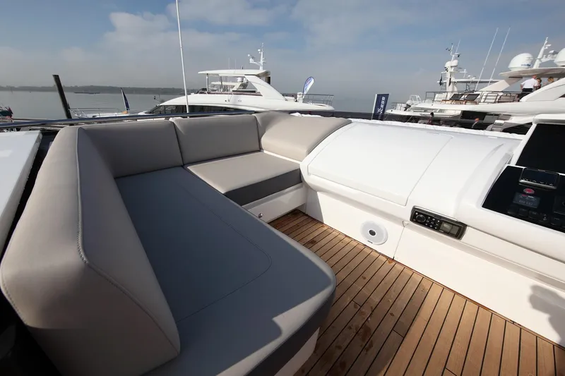 Yacht Photos Pics Luxurious seating area on 2018 Princess S65 yacht with wooden deck and modern design.