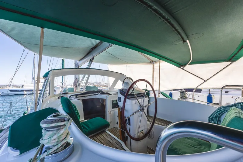  Yacht Photos Pics Beneteau Oceanis 40 CC yacht cockpit, 2000 model, with green canopy and steering wheel.