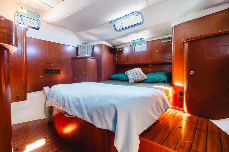  Yacht Photos Pics Luxurious cabin interior of 2000 Beneteau Oceanis 40 CC yacht with wooden finish.