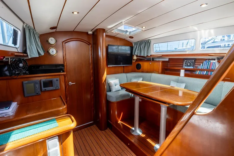  Yacht Photos Pics Interior of 2000 Beneteau Oceanis 40 CC yacht with wood finish and cozy seating area.