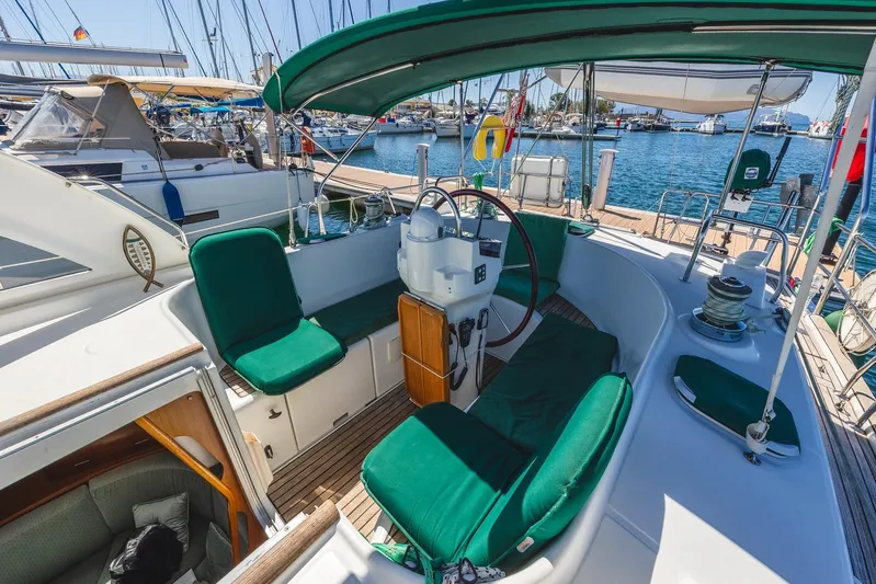  Yacht Photos Pics Cockpit of 2000 Beneteau Oceanis 40 CC sailboat with green seating and steering wheel.