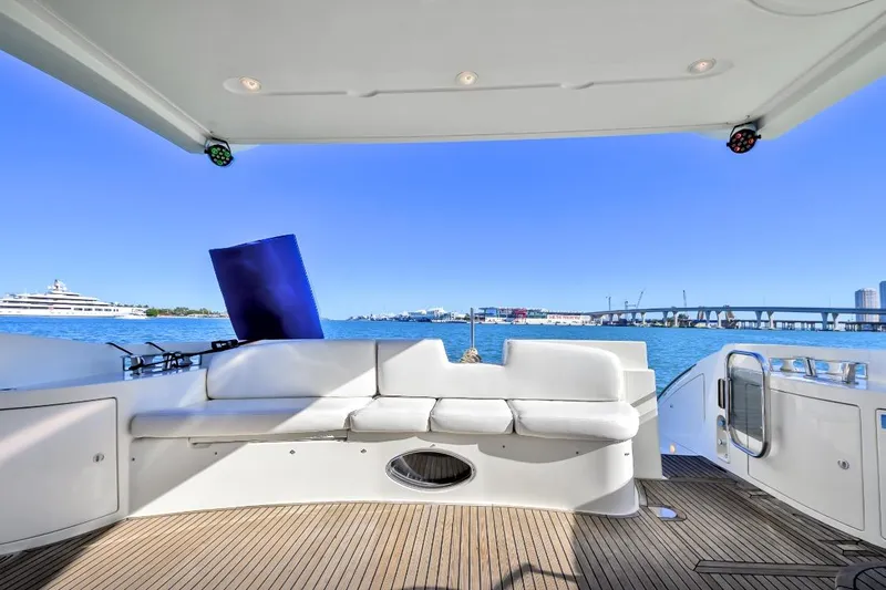  Yacht Photos Pics Luxurious 2006 Azimut Fly yacht deck with white seating and ocean view.
