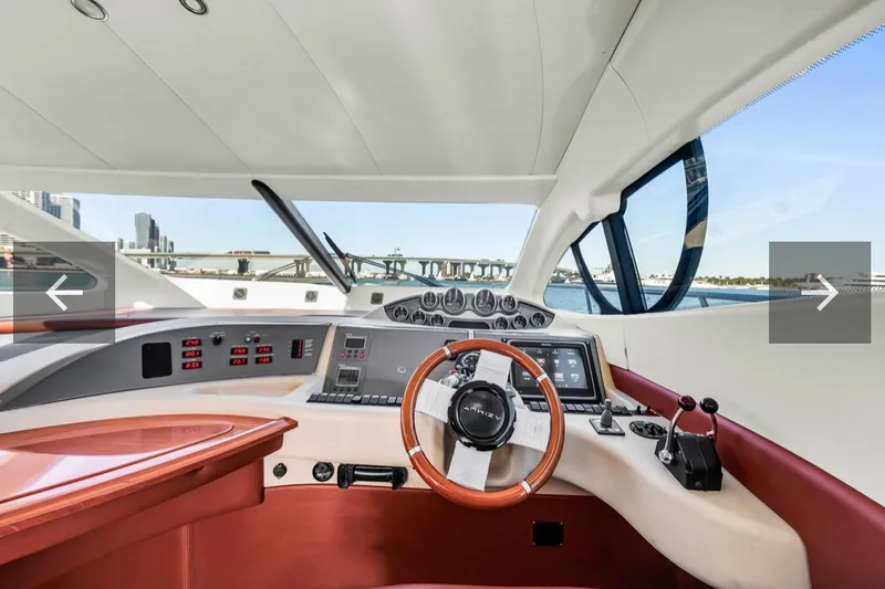  Yacht Photos Pics Interior view of 2006 Azimut Fly yacht cockpit with modern controls and steering wheel.