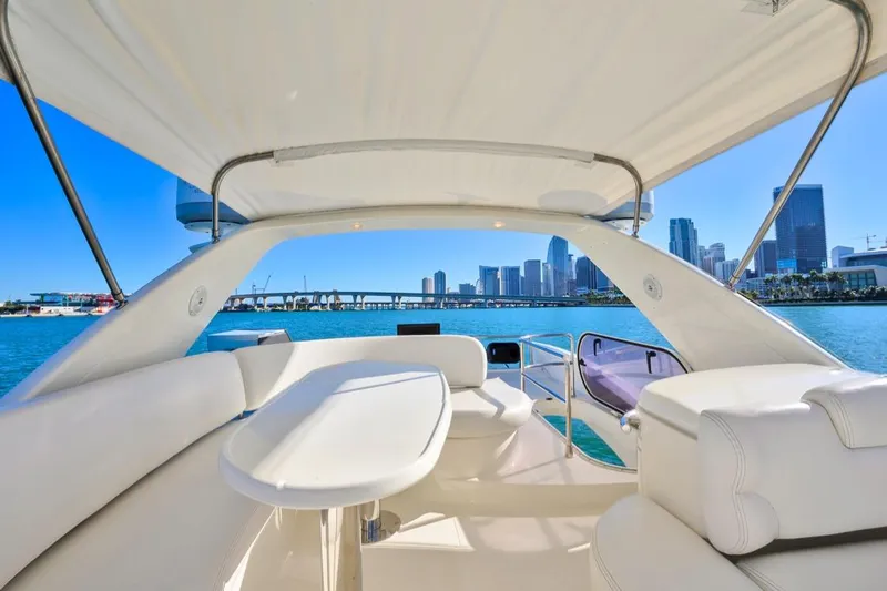  Yacht Photos Pics Luxurious 2006 Azimut Fly yacht interior with city skyline view.