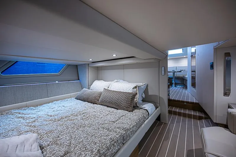  Yacht Photos Pics Luxurious interior of 2025 Formula 500 Super Sport Crossover yacht cabin with modern bedding.
