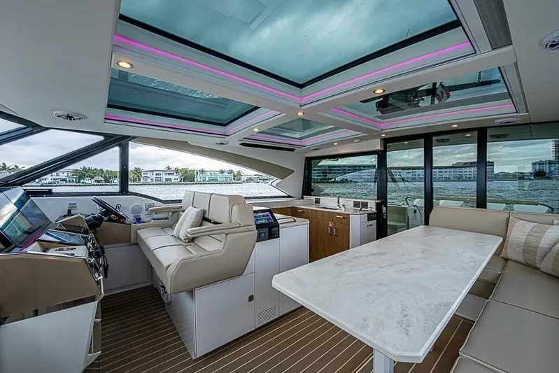  Yacht Photos Pics Luxurious interior of 2025 Formula 500 Super Sport Crossover yacht with modern seating and panoramic views.