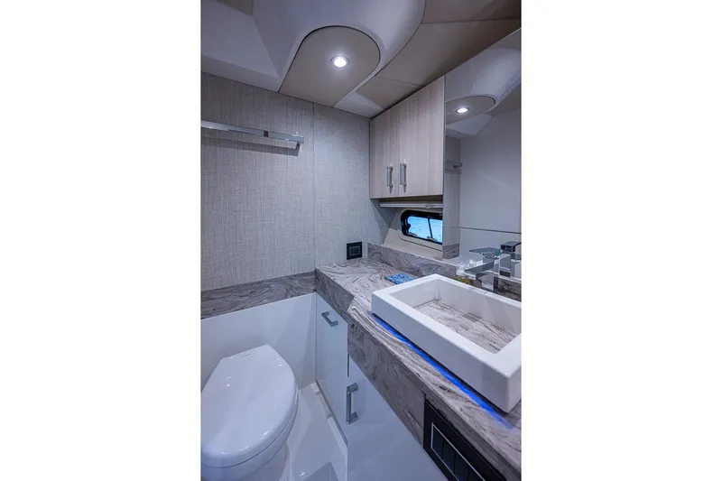  Yacht Photos Pics Luxurious bathroom in 2025 Formula 500 Super Sport Crossover yacht, featuring modern fixtures and elegant design.