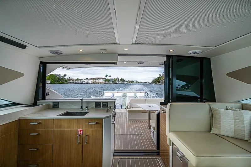  Yacht Photos Pics Interior of 2025 Formula 500 Super Sport Crossover yacht with modern kitchen and seating area.