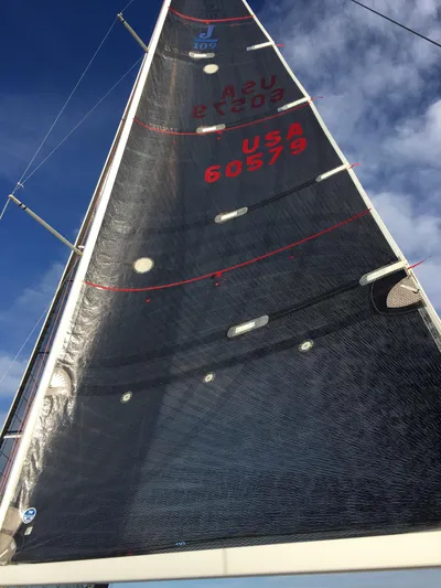 Natural Mystic Yacht Photos Pics Sail of 2003 J Boats J/109 against a blue sky.