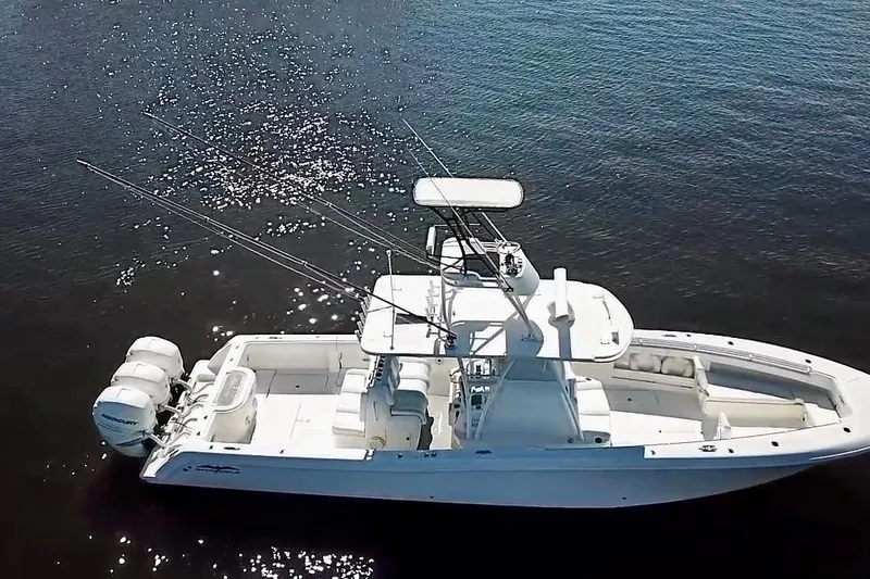  Yacht Photos Pics 2020 Invincible 39 Open Fisherman boat on calm water, aerial view.