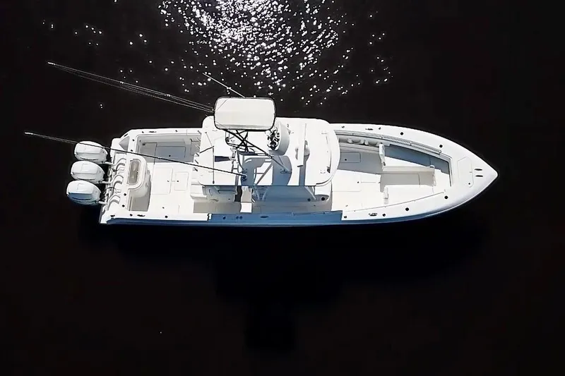  Yacht Photos Pics 2020 Invincible 39 Open Fisherman boat, aerial view on dark water.