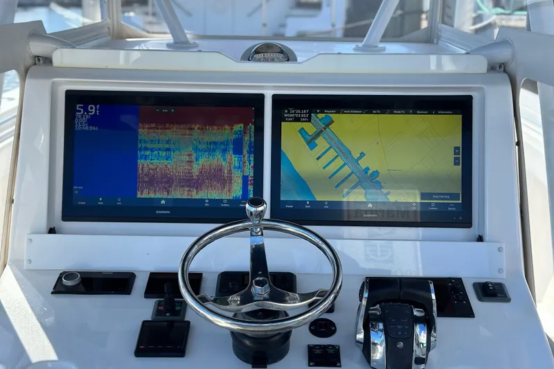  Yacht Photos Pics 2020 Invincible 39 Open Fisherman dashboard with dual Garmin displays and steering wheel.