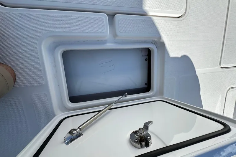  Yacht Photos Pics 2020 Invincible 39 Open Fisherman boat storage compartment with latch and hydraulic support.