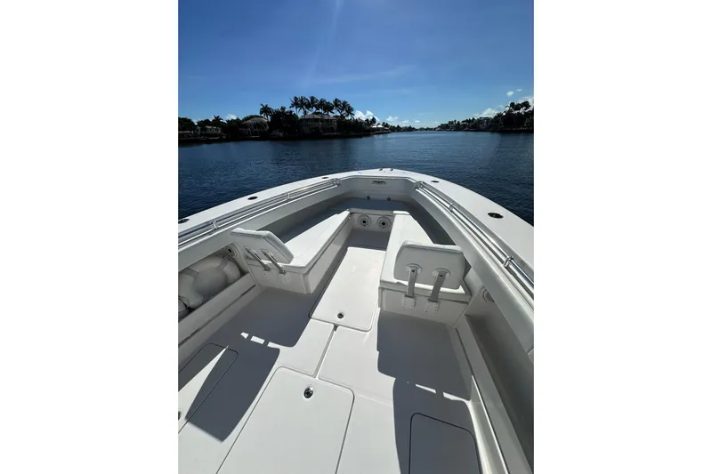  Yacht Photos Pics 2020 Invincible 39 Open Fisherman boat on calm water under clear blue sky.