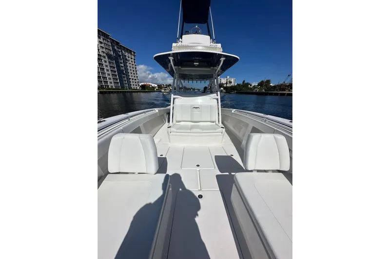  Yacht Photos Pics 2020 Invincible 39 Open Fisherman boat on water, featuring spacious seating and sleek design.