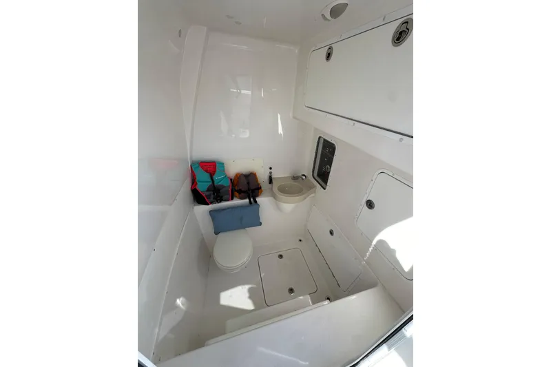  Yacht Photos Pics 2020 Invincible 39 Open Fisherman boat interior with toilet and storage compartments.