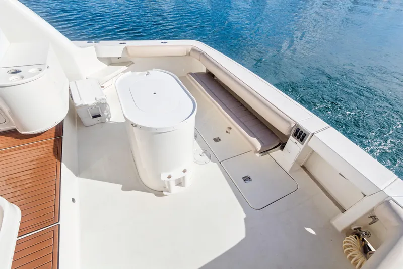 Sandie Lee Yacht Photos Pics 2000 Sea Ray 370 Express Cruiser deck with seating and storage, overlooking blue water.