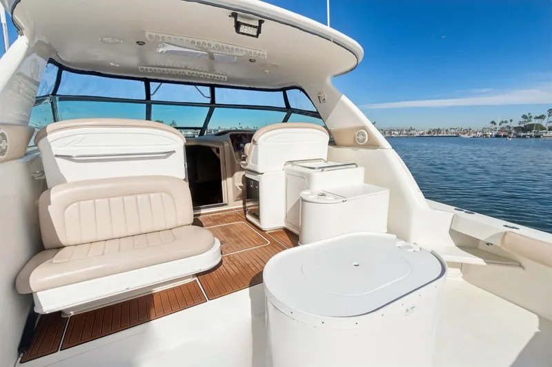 Sandie Lee Yacht Photos Pics 2000 Sea Ray 370 Express Cruiser interior with seating, ocean view, and clear blue sky.