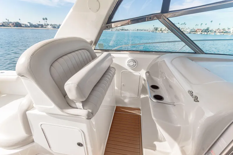 Sandie Lee Yacht Photos Pics 2000 Sea Ray 370 Express Cruiser interior with plush seating and ocean view.